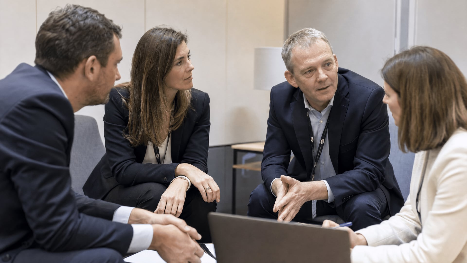 Small professional meeting room inside the Bilbao Exhibition Centre with people at a table.